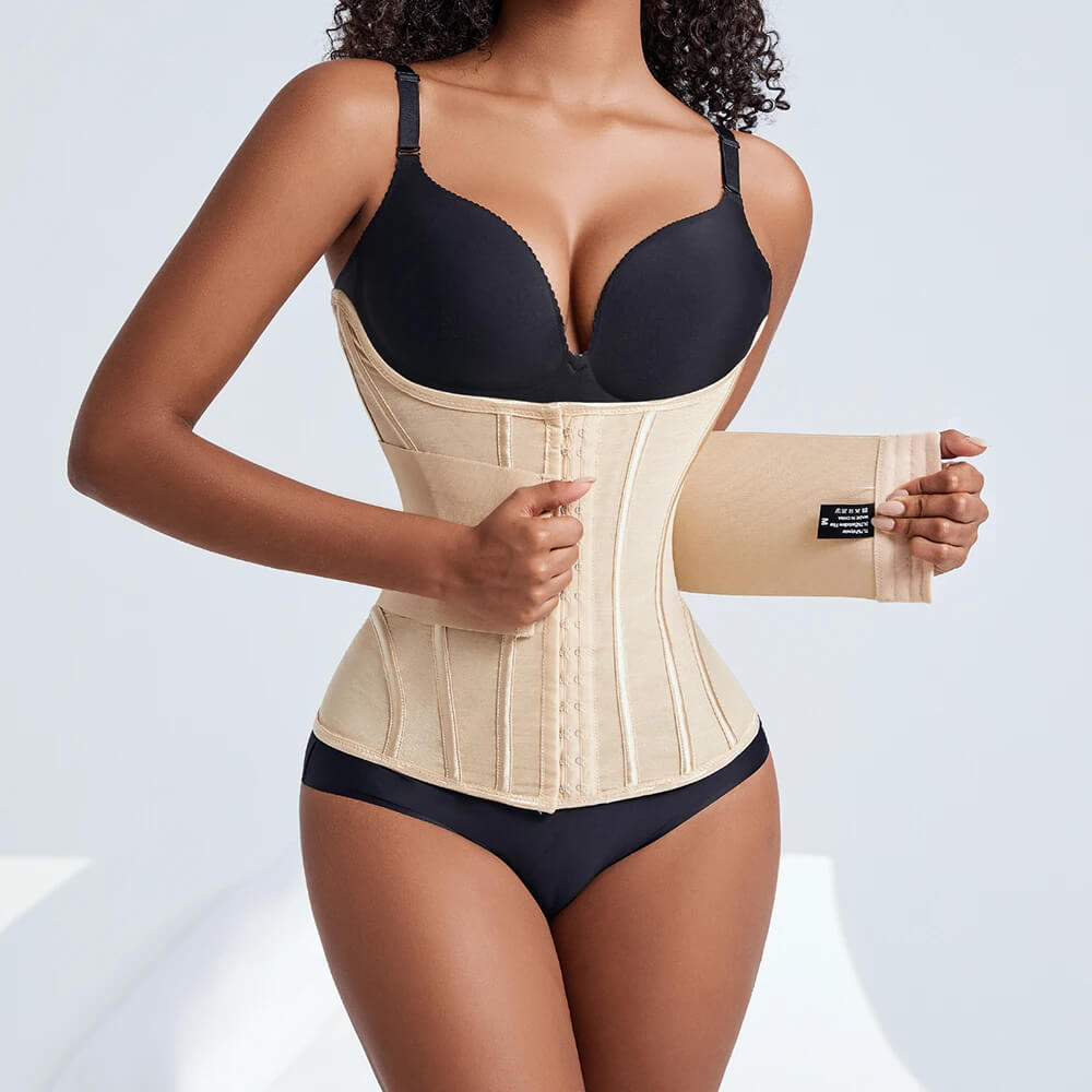 Woman wearing a beige waist trainer with a plain background