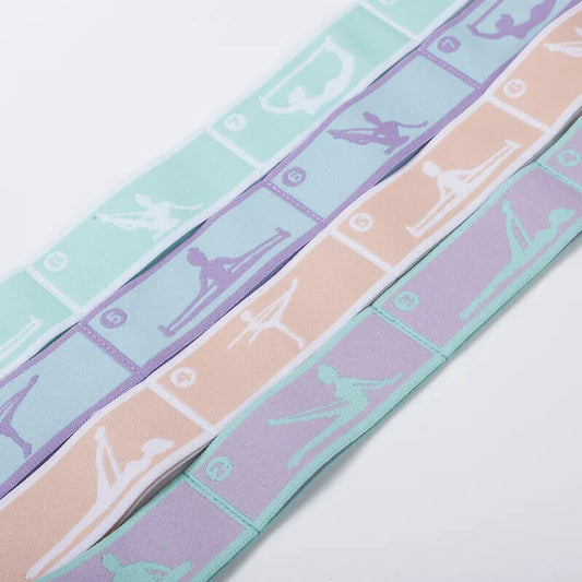 Three strips of colorful ribbon with white patterns on a light gray background