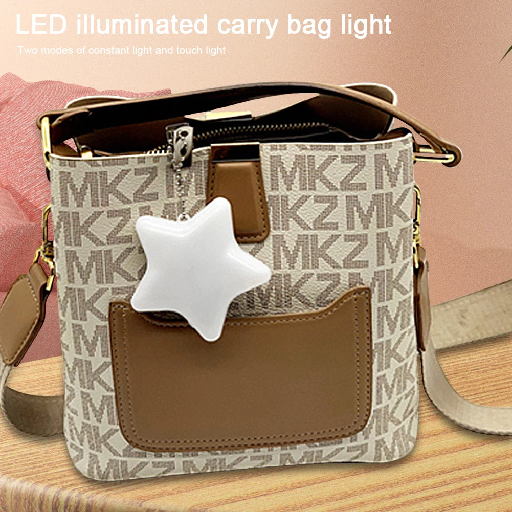 Handbag with star-shaped LED light on a wooden surface