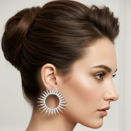 Woman wearing a large, decorative earring with a neutral background