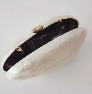 Black and gold bracelet on a white background