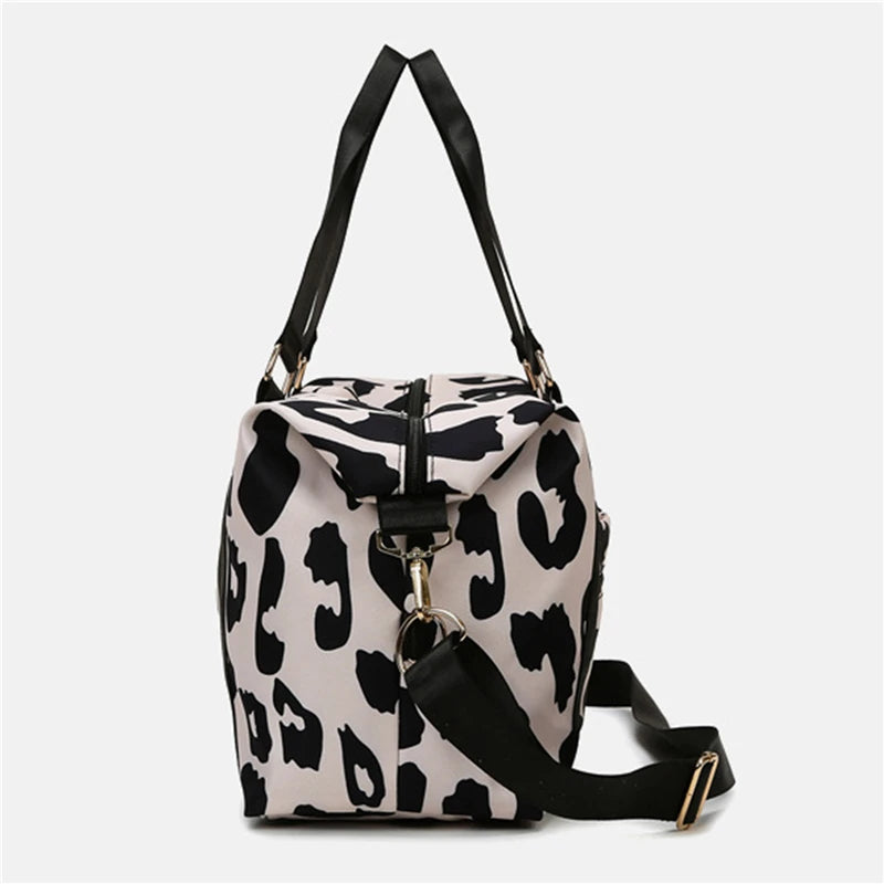 Leopard print backpack with black straps on a white background